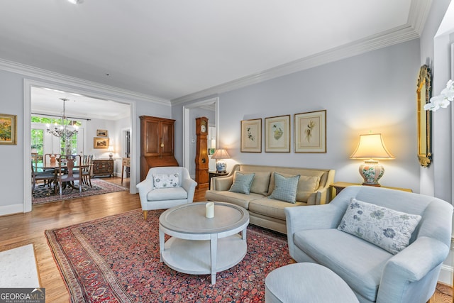 1180 Brookhaven Park Pl, Brookhaven, GA 30319 - living area with baseboards, ornamental molding, wood finished floors, and a notable chandelier
