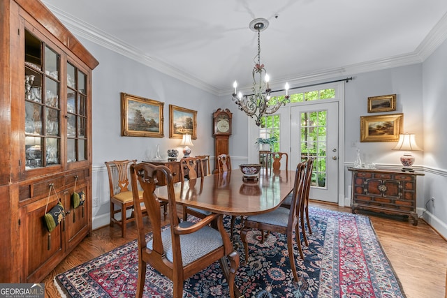 1180 Brookhaven Park Pl, Brookhaven, GA 30319 - dining space with crown molding, light wood-style flooring, and a notable chandelier