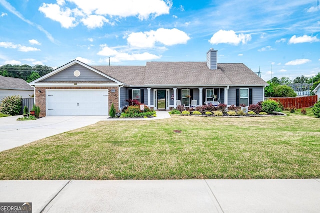 99 Mcmillian Ct, Winder, GA 30680 - single story home featuring concrete driveway, covered porch, a garage, fence, and a front yard