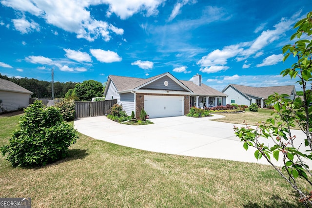 99 Mcmillian Ct, Winder, GA 30680 - ranch-style house featuring a front lawn, driveway, fence, brick siding, and an attached garage
