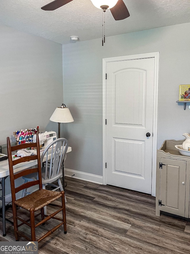 99 Mcmillian Ct, Winder, GA 30680 - home office with baseboards, a textured ceiling, dark wood-style floors, and ceiling fan