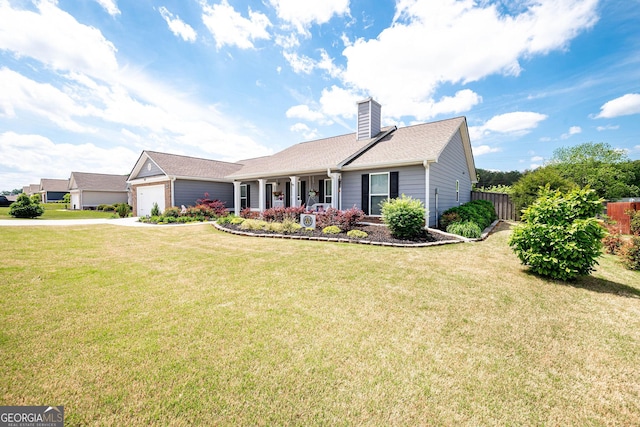 99 Mcmillian Ct, Winder, GA 30680 - view of front of home featuring fence, a front lawn, a chimney, and a garage