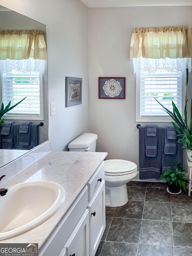99 Mcmillian Ct, Winder, GA 30680 - bathroom featuring toilet and vanity