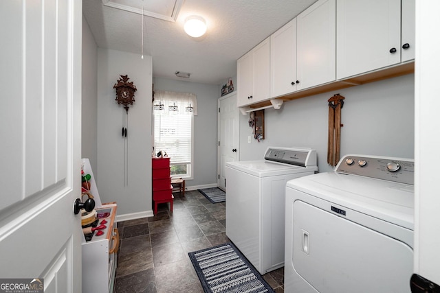99 Mcmillian Ct, Winder, GA 30680 - laundry area with washing machine and clothes dryer, attic access, a textured ceiling, baseboards, and cabinet space