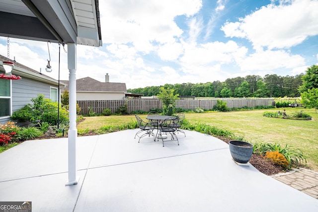 99 Mcmillian Ct, Winder, GA 30680 - view of patio / terrace featuring a fenced backyard and outdoor dining space