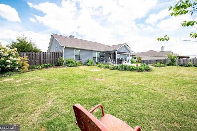 99 Mcmillian Ct, Winder, GA 30680 - rear view of property with a yard, a patio, and a fenced backyard