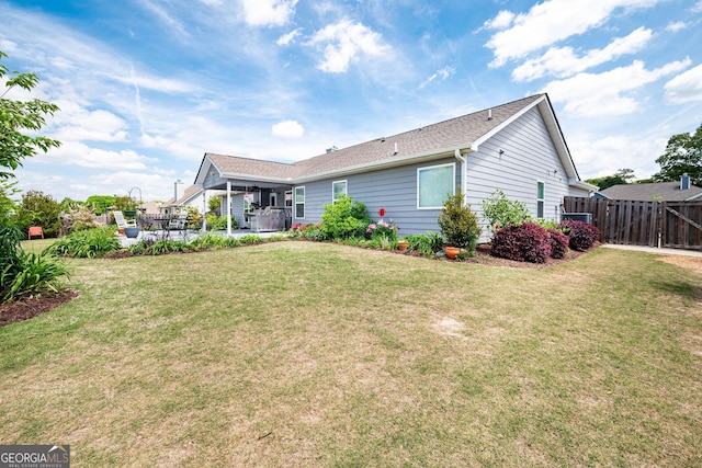 99 Mcmillian Ct, Winder, GA 30680 - back of house featuring a yard, fence, and a patio area