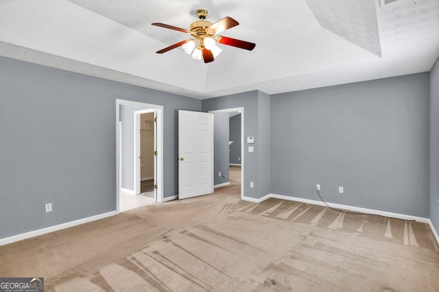 1220 Skipping Rock Ln SW, Grayson, GA 30017 - unfurnished bedroom featuring a raised ceiling, baseboards, and carpet flooring