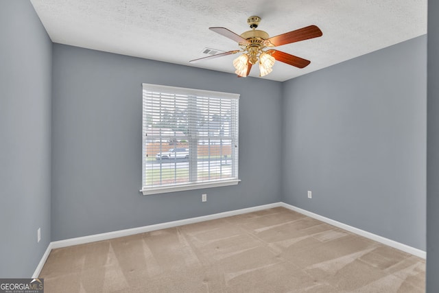 1220 Skipping Rock Ln SW, Grayson, GA 30017 - spare room featuring ceiling fan, carpet floors, a textured ceiling, baseboards, and visible vents