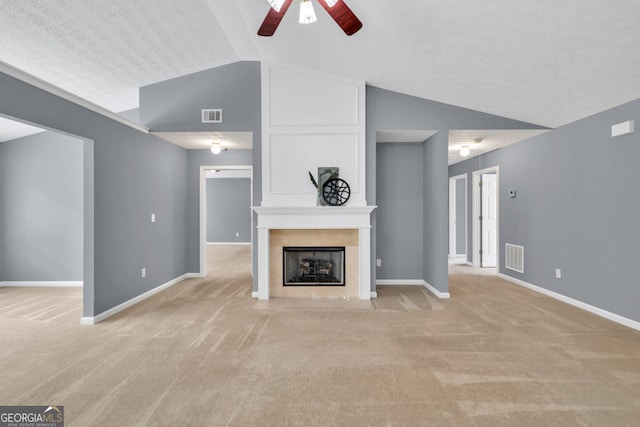 1220 Skipping Rock Ln SW, Grayson, GA 30017 - unfurnished living room featuring ceiling fan, light colored carpet, lofted ceiling, and visible vents