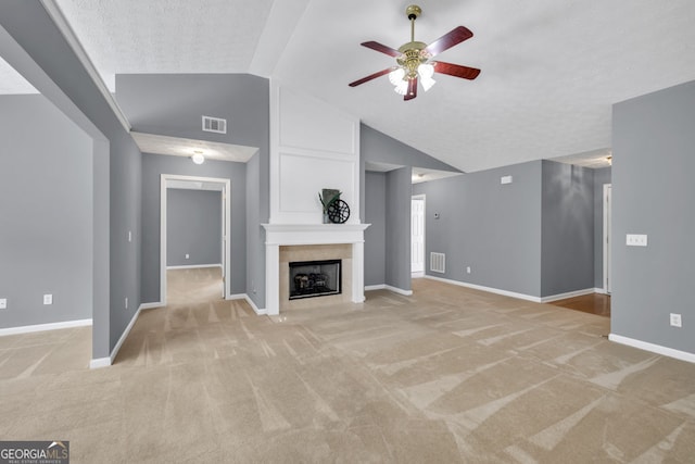 1220 Skipping Rock Ln SW, Grayson, GA 30017 - unfurnished living room with visible vents, a ceiling fan, light colored carpet, and lofted ceiling