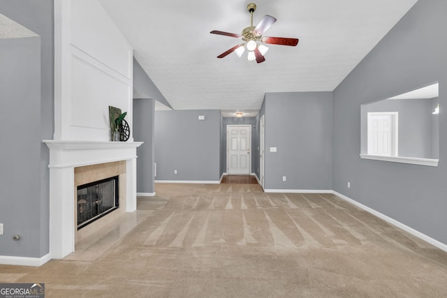 1220 Skipping Rock Ln SW, Grayson, GA 30017 - unfurnished living room with a fireplace, ceiling fan, light carpet, and vaulted ceiling