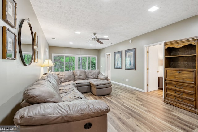 4761 Gateway Ln, Flowery Branch, GA 30542 - living room featuring a textured ceiling, light wood finished floors, ceiling fan, and recessed lighting
