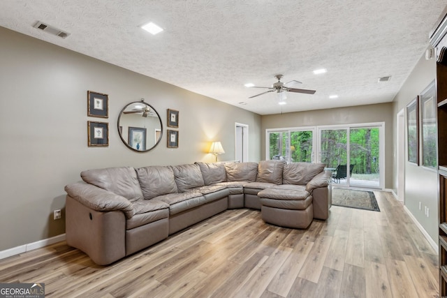4761 Gateway Ln, Flowery Branch, GA 30542 - living area featuring a ceiling fan, light wood-style floors, recessed lighting, and a textured ceiling