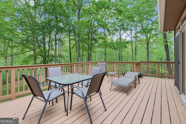 4761 Gateway Ln, Flowery Branch, GA 30542 - wooden terrace with outdoor dining space