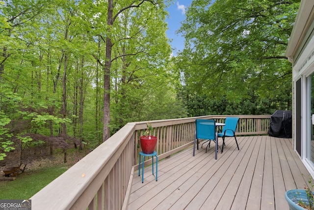 4761 Gateway Ln, Flowery Branch, GA 30542 - wooden terrace with grilling area and outdoor dining area