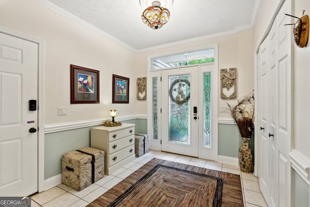 4761 Gateway Ln, Flowery Branch, GA 30542 - entryway featuring light tile patterned floors and ornamental molding