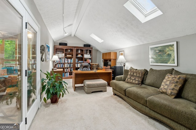 4761 Gateway Ln, Flowery Branch, GA 30542 - carpeted living room featuring a skylight, an office area, and a textured ceiling