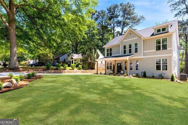 2553 Creekwood Ter, Decatur, GA 30030 - rear view of property featuring board and batten siding, a yard, central AC unit, and covered porch