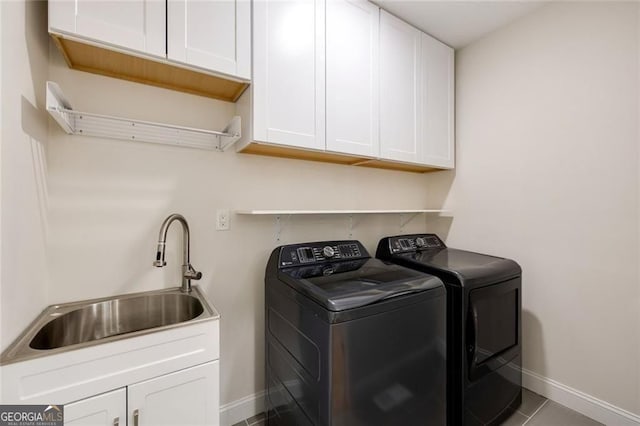 2553 Creekwood Ter, Decatur, GA 30030 - washroom featuring separate washer and dryer, baseboards, cabinet space, and tile patterned flooring
