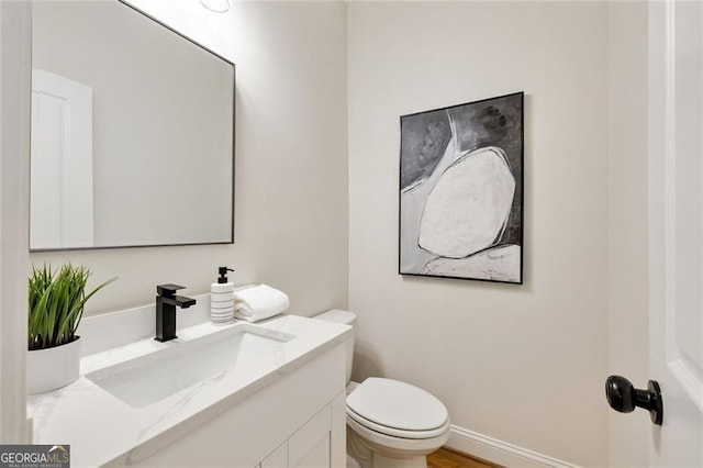 2553 Creekwood Ter, Decatur, GA 30030 - half bathroom featuring vanity and toilet