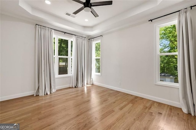 2553 Creekwood Ter, Decatur, GA 30030 - spare room featuring a raised ceiling, ceiling fan, light wood-style floors, baseboards, and recessed lighting