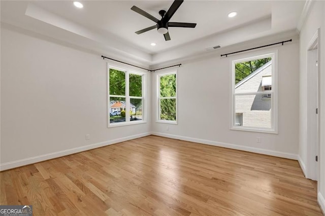 2553 Creekwood Ter, Decatur, GA 30030 - empty room with light wood-type flooring, a raised ceiling, ceiling fan, recessed lighting, and baseboards