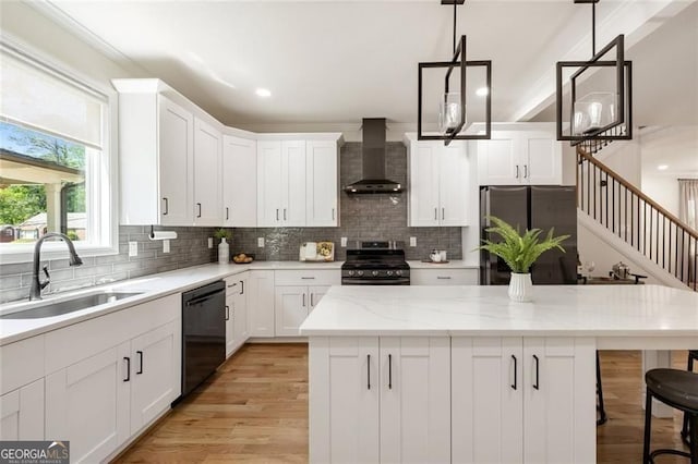 2553 Creekwood Ter, Decatur, GA 30030 - kitchen featuring wall chimney exhaust hood, appliances with stainless steel finishes, a sink, decorative backsplash, and white cabinetry
