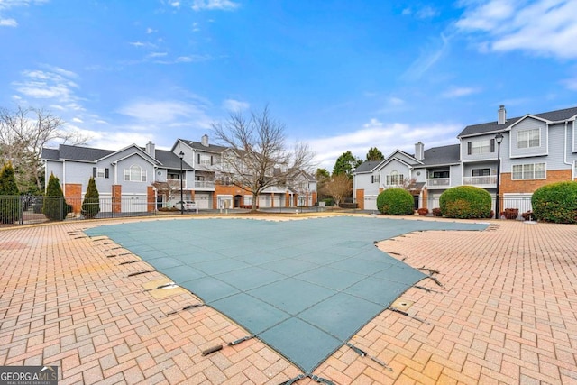 406 Vinings Forest Cir SE, Smyrna, GA 30080 - community pool with fence, a patio area, and a residential view