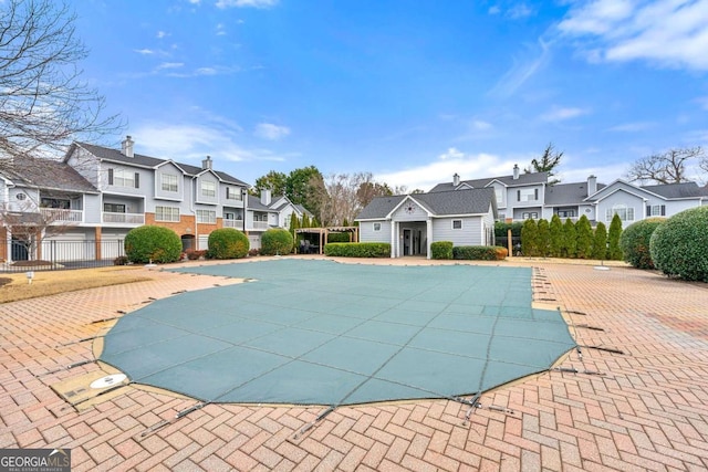 406 Vinings Forest Cir SE, Smyrna, GA 30080 - pool with an outdoor structure, fence, a residential view, and a patio