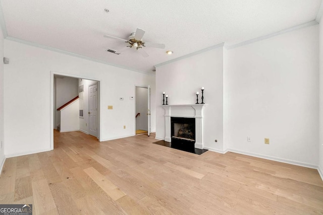 406 Vinings Forest Cir SE, Smyrna, GA 30080 - unfurnished living room with light wood finished floors, crown molding, and ceiling fan