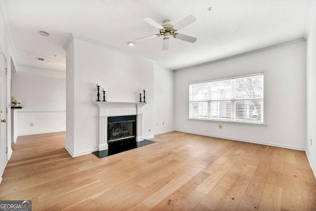 406 Vinings Forest Cir SE, Smyrna, GA 30080 - unfurnished living room featuring a ceiling fan, wood finished floors, a fireplace, baseboards, and visible vents