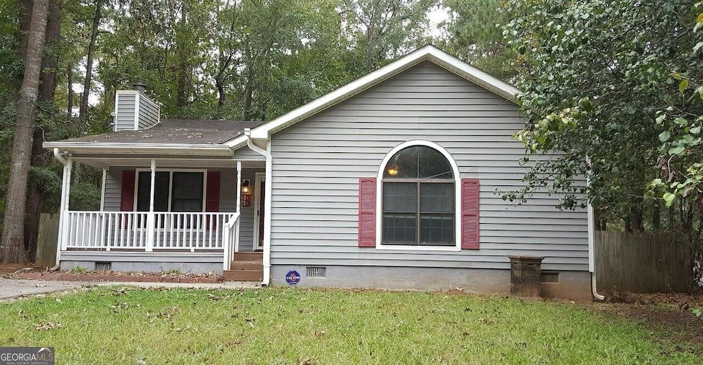 1303 Saddle Horn Dr, Macon, GA 31220 - ranch-style house with a porch, a chimney, and crawl space