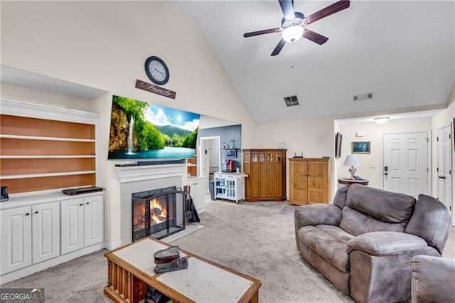 12 Mulberry Rd, Winder, GA 30680 - living room featuring light carpet, ceiling fan, a fireplace with flush hearth, and lofted ceiling