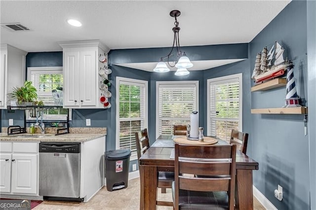 12 Mulberry Rd, Winder, GA 30680 - kitchen featuring dishwasher, white cabinets, a chandelier, and healthy amount of natural light