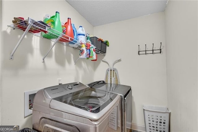 12 Mulberry Rd, Winder, GA 30680 - laundry room featuring separate washer and dryer and a textured ceiling