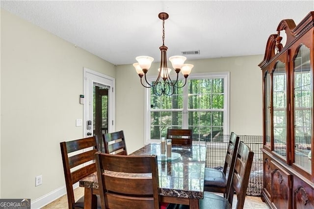 12 Mulberry Rd, Winder, GA 30680 - dining room with a chandelier and baseboards