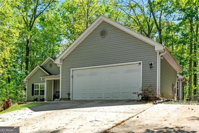 12 Mulberry Rd, Winder, GA 30680 - view of front facade with a garage and concrete driveway