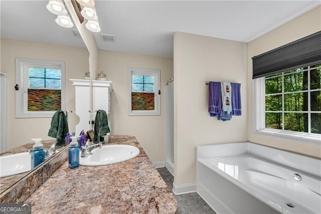 12 Mulberry Rd, Winder, GA 30680 - full bathroom featuring a stall shower, vanity, and a bath