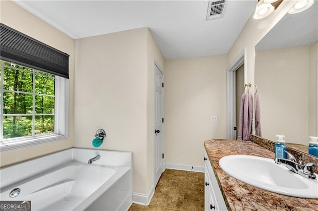 12 Mulberry Rd, Winder, GA 30680 - bathroom featuring vanity, a bath, and tile patterned flooring