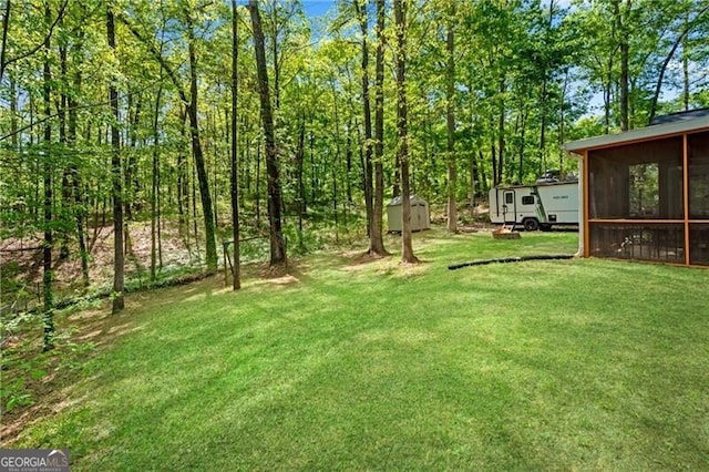 12 Mulberry Rd, Winder, GA 30680 - view of grassy yard featuring a sunroom and a storage shed