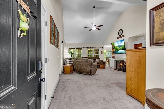 12 Mulberry Rd, Winder, GA 30680 - carpeted living area featuring high vaulted ceiling, a fireplace with flush hearth, and ceiling fan
