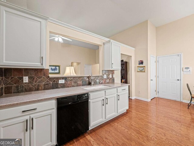2402 Jasmine Glen Dr, Buford, GA 30519 - kitchen featuring tasteful backsplash, a sink, light wood-type flooring, ceiling fan, and black dishwasher