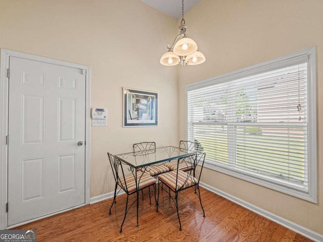 2402 Jasmine Glen Dr, Buford, GA 30519 - dining room featuring baseboards and wood finished floors