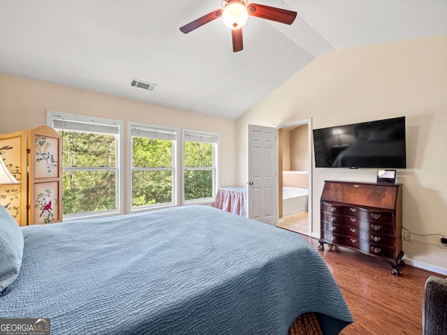 2402 Jasmine Glen Dr, Buford, GA 30519 - bedroom with lofted ceiling, wood finished floors, a ceiling fan, and ensuite bathroom
