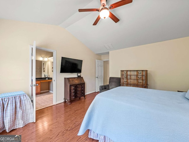 2402 Jasmine Glen Dr, Buford, GA 30519 - bedroom featuring wood finished floors, lofted ceiling, a ceiling fan, and ensuite bath