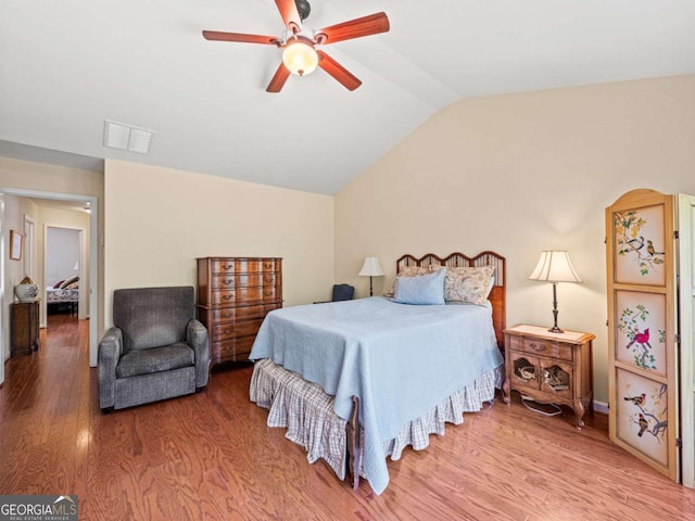 2402 Jasmine Glen Dr, Buford, GA 30519 - bedroom featuring wood finished floors, lofted ceiling, and ceiling fan