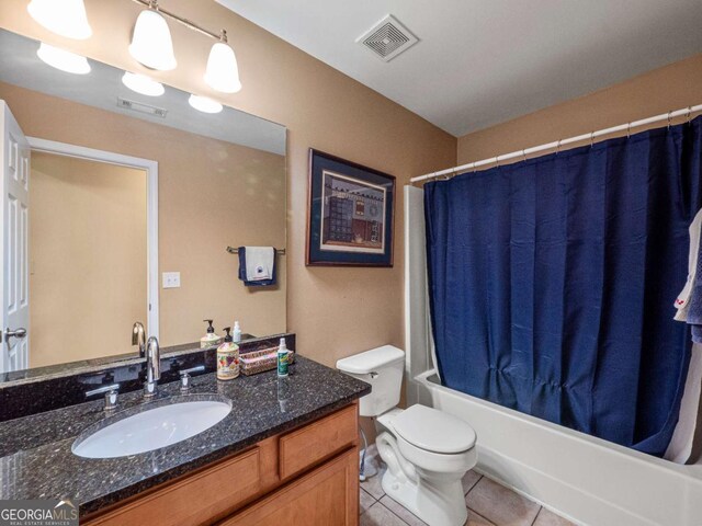 2402 Jasmine Glen Dr, Buford, GA 30519 - full bathroom featuring tile patterned floors, visible vents, vanity, and toilet