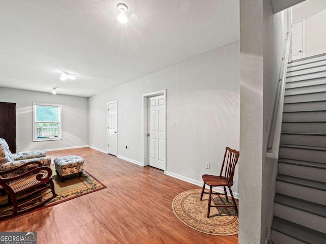 2402 Jasmine Glen Dr, Buford, GA 30519 - living area with baseboards, wood finished floors, and stairs