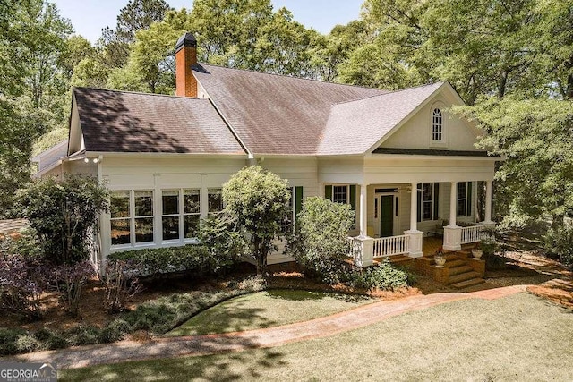 835 Timothy Rd, Athens, GA 30606 - view of front of property featuring a porch, a shingled roof, and a chimney